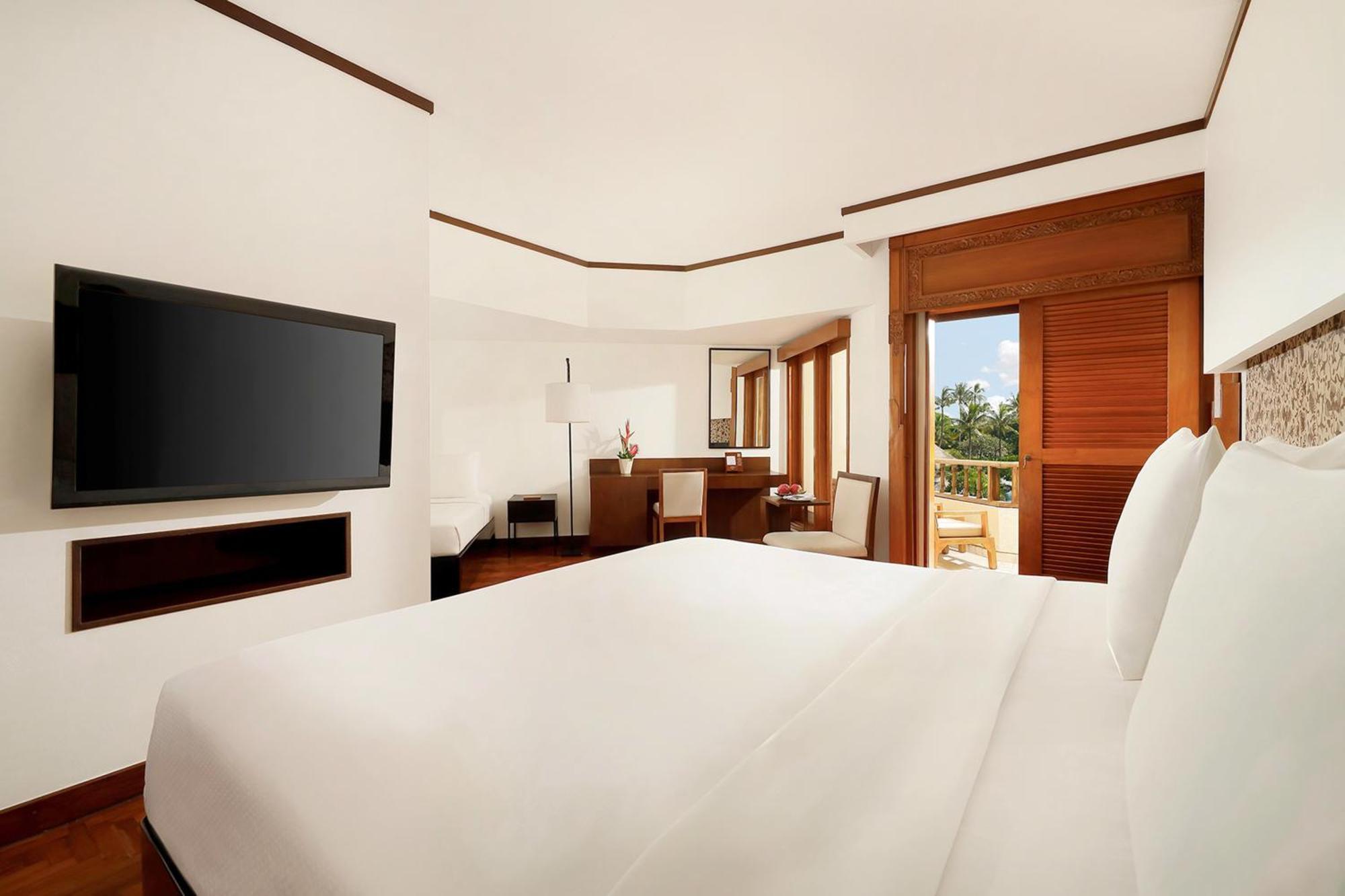 Nusa Dua Beach Hotel And Spa - Handwritten Collection Esterno foto A bedroom at the hotel